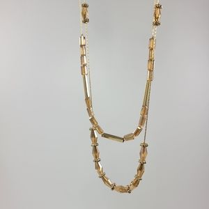 Set of necklace and earrings. Yellow gold with shiny stones. 19 1/2" inches long
